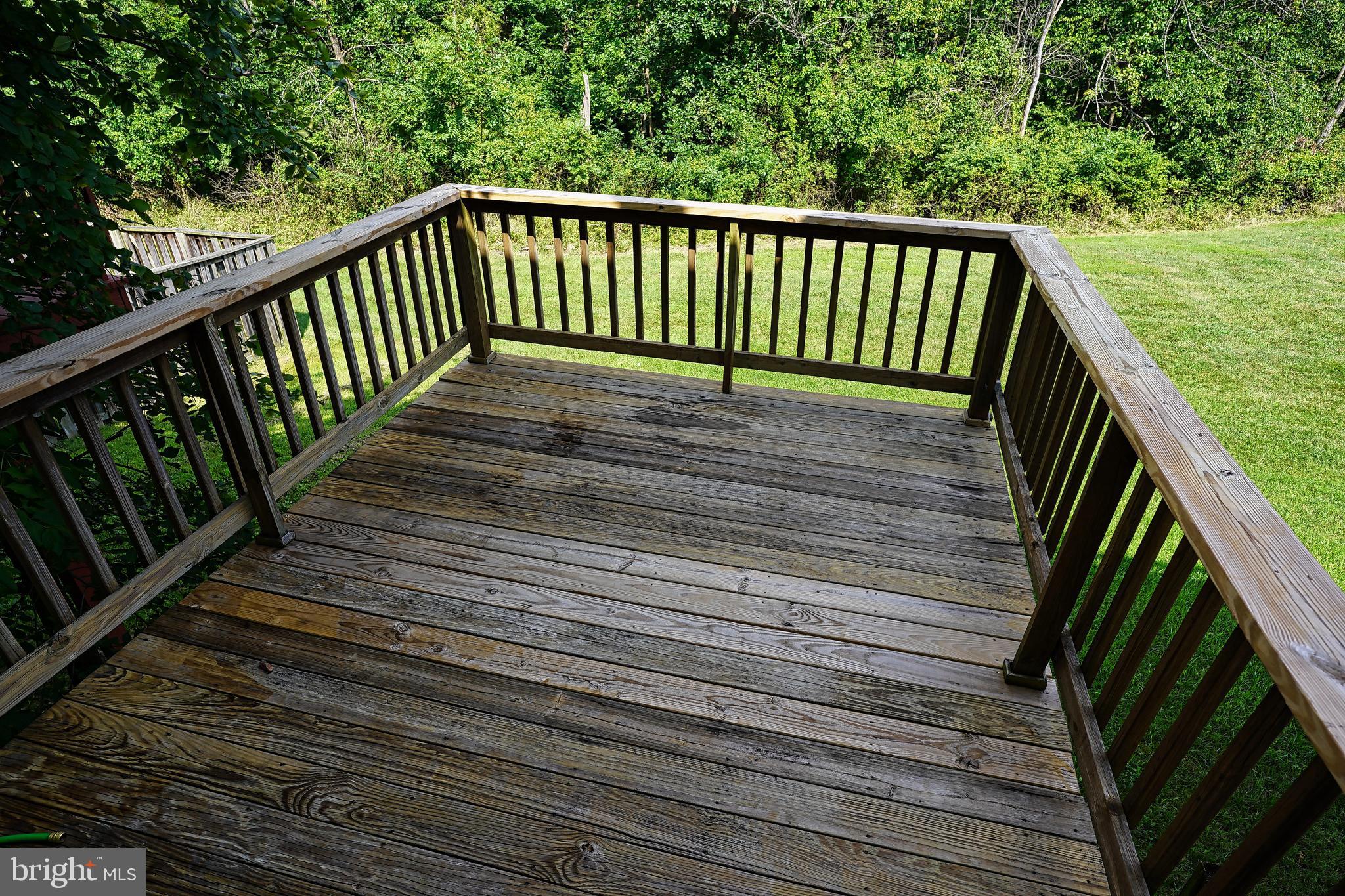 6948 Rockfield Road Baltimore, MD 21244 - Photo 10 of 47 a balcony with view of trees in the background