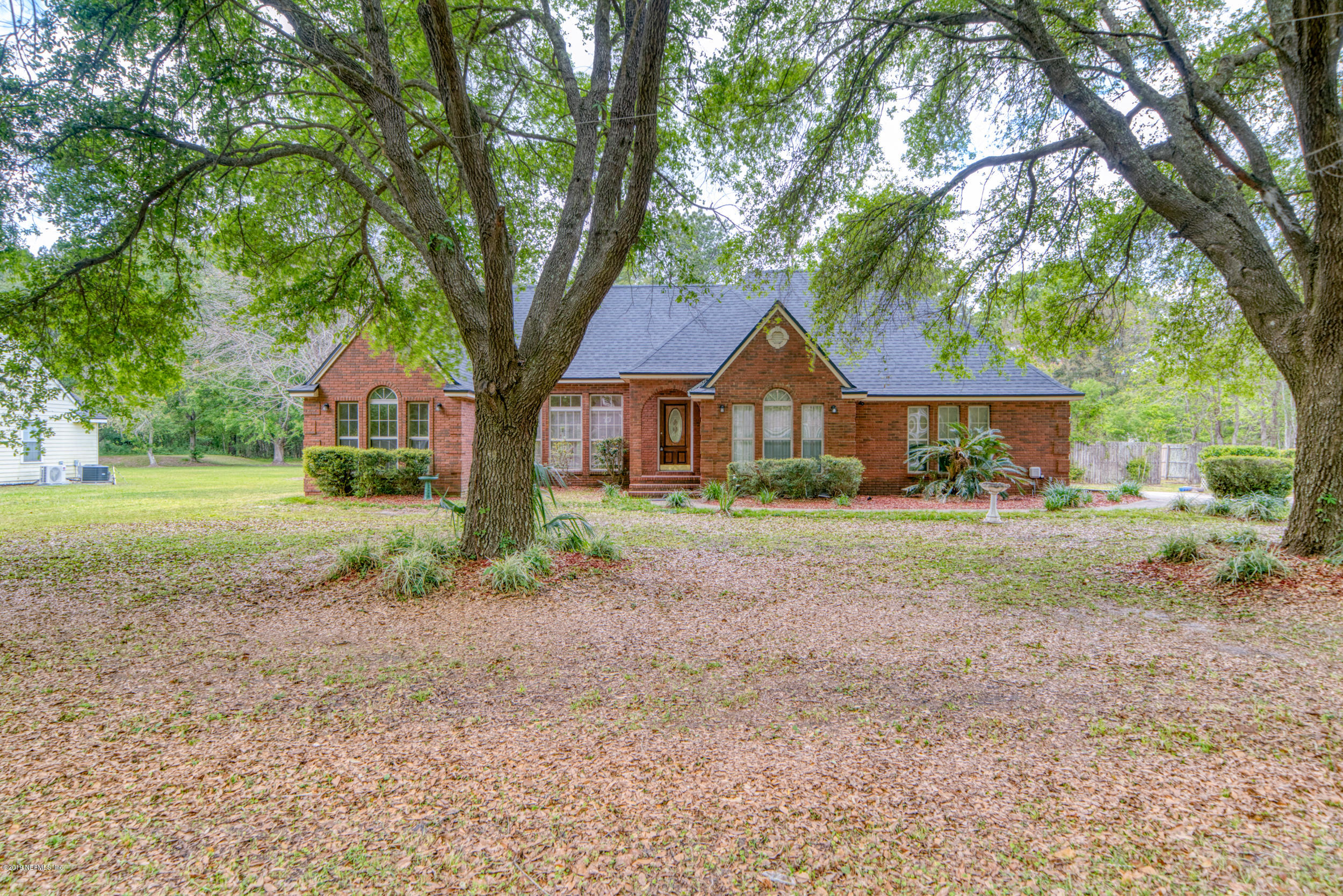 43611 Ratliff Road Callahan, FL 32011 - Photo 2 of 43 a front view of a house with garden