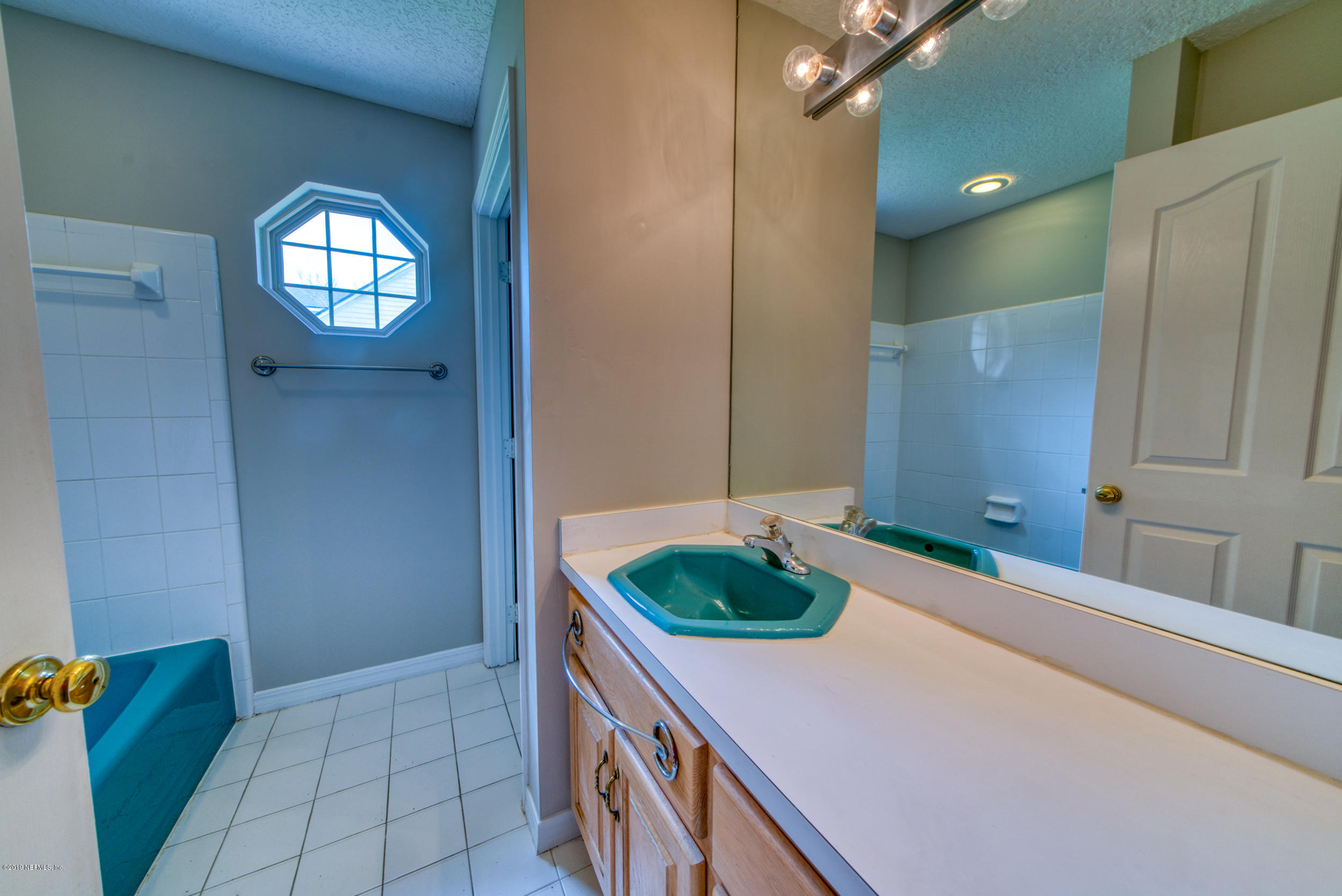 43611 Ratliff Road Callahan, FL 32011 - Photo 29 of 43 a kitchen with a sink and cabinets