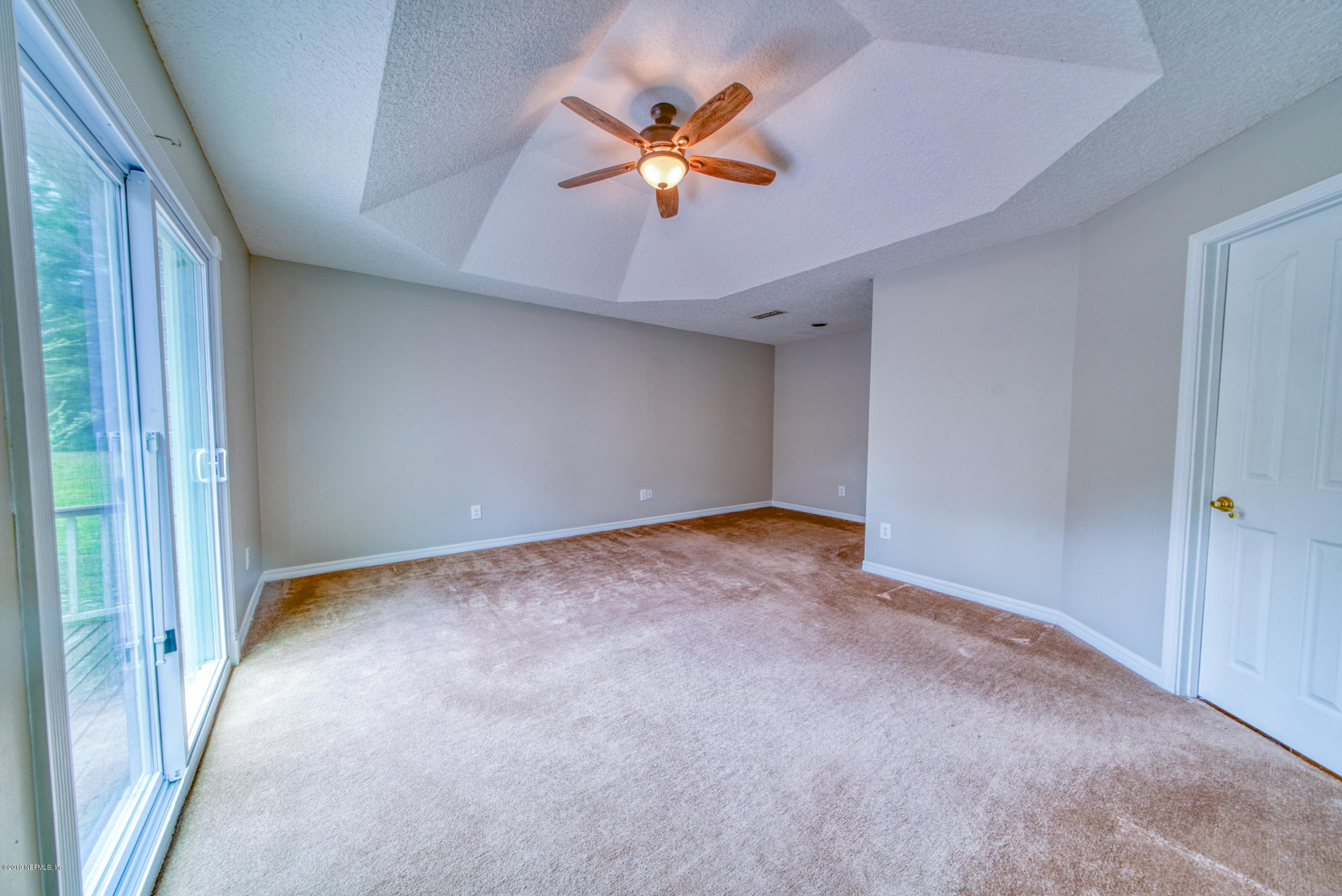 43611 Ratliff Road Callahan, FL 32011 - Photo 31 of 43 wooden floor in an empty room with a ceiling fan