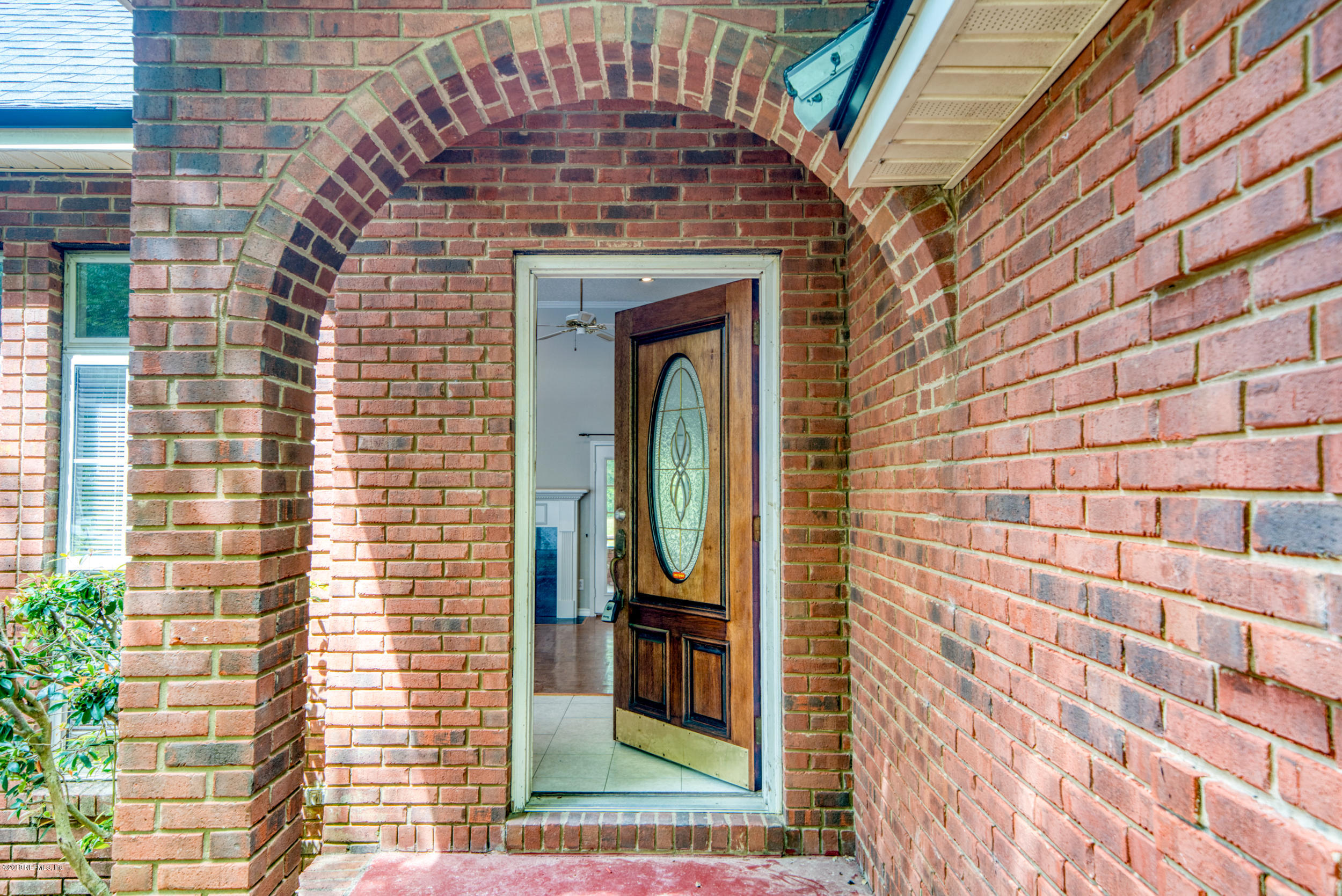 43611 Ratliff Road Callahan, FL 32011 - Photo 4 of 43 a view of a brick wall with a door