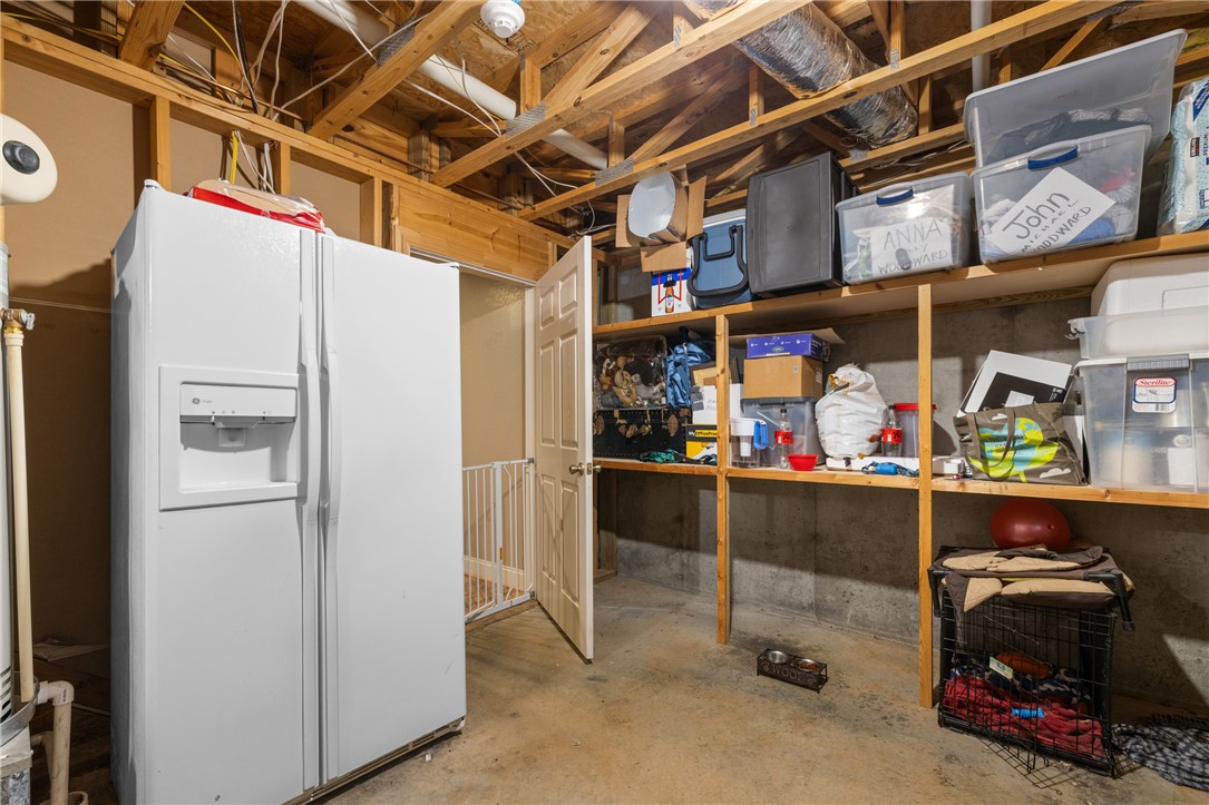 106 Red Maple Way Clemson, SC 29631 - Photo 36 of 49 Unfinished basement utility space provides built-in wooden shelving and concrete floors.