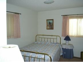2730 Ridge Road Prescott, AZ 86301 - Photo 2 of 6 a bedroom with a bed and a window