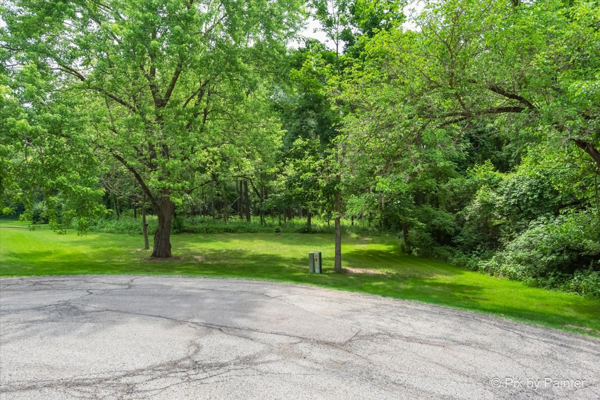 39225 Rangers Way Antioch, IL 60002 - Photo 7 of 7 a green field with lots of trees in it