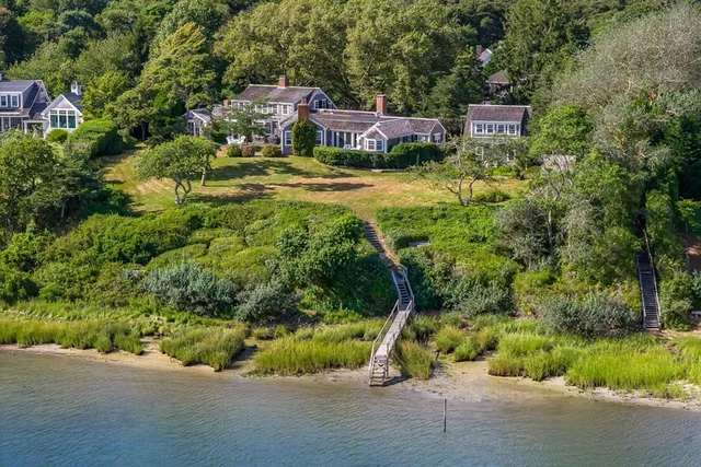 an aerial view of a house with yard swimming pool and outdoor seating