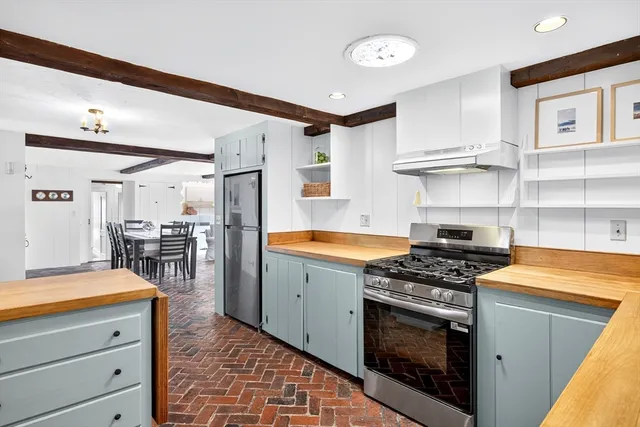 a kitchen with stainless steel appliances granite countertop a stove and a sink