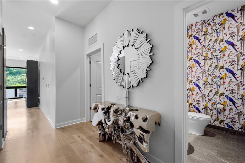 2545 Penn Avenue, Unit 601 Pittsburgh, PA 15222 - Photo 11 of 48 a view of a room with lots of stuff and hardwood floor