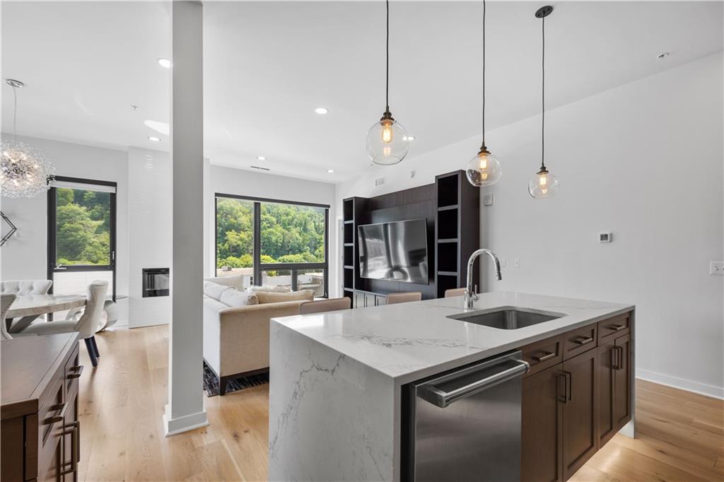 2545 Penn Avenue, Unit 601 Pittsburgh, PA 15222 - Photo 23 of 48 a kitchen with a sink and a refrigerator