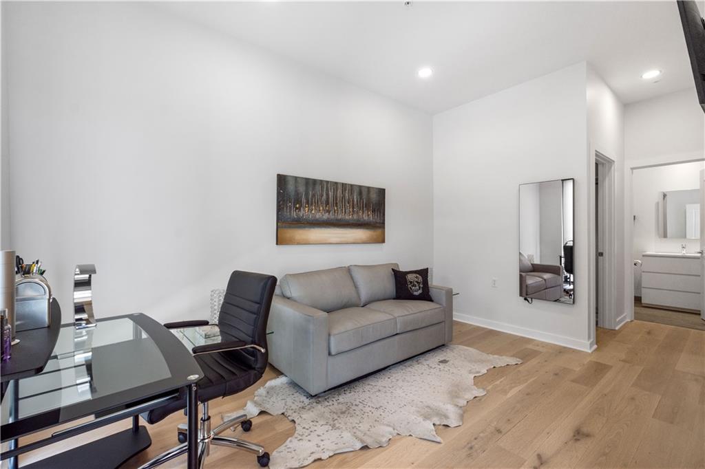 2545 Penn Avenue, Unit 601 Pittsburgh, PA 15222 - Photo 24 of 48 a living room with furniture and a flat screen tv