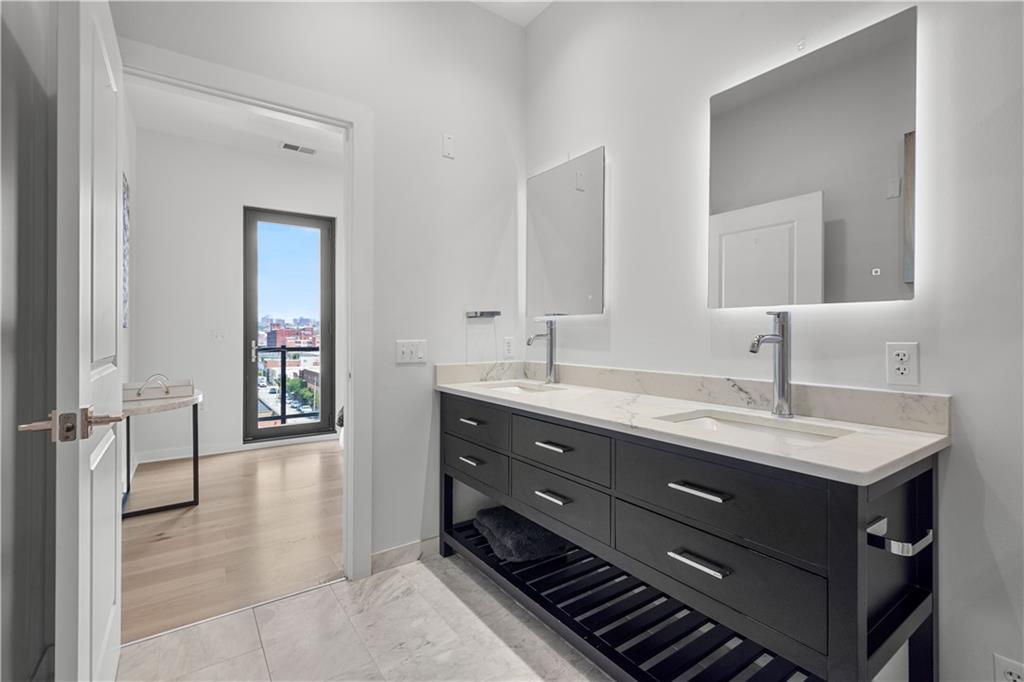 2545 Penn Avenue, Unit 601 Pittsburgh, PA 15222 - Photo 42 of 48 a bathroom with a sink and a mirror