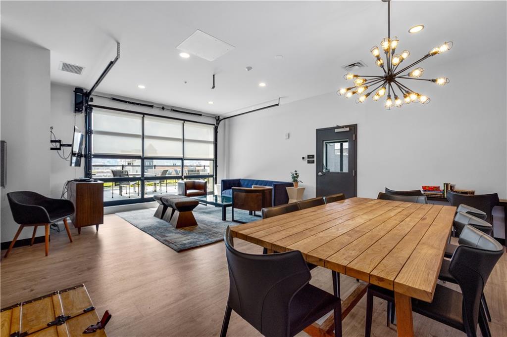 2545 Penn Avenue, Unit 601 Pittsburgh, PA 15222 - Photo 47 of 48 a view of a dining room with furniture window and wooden floor