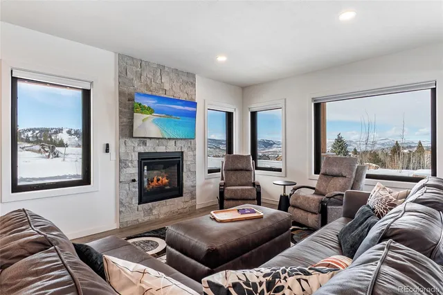 an empty room with wooden floor and a window