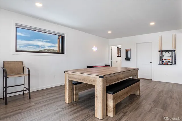 a large kitchen with a table and chairs