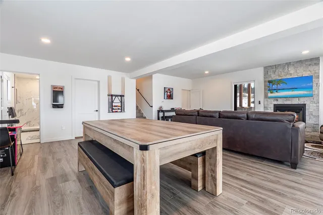 a view of a dining room with furniture and wooden floor