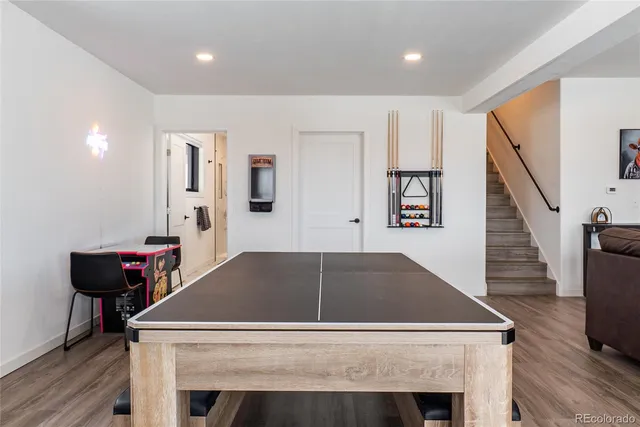 a view of washer and dryer with kitchen in the background