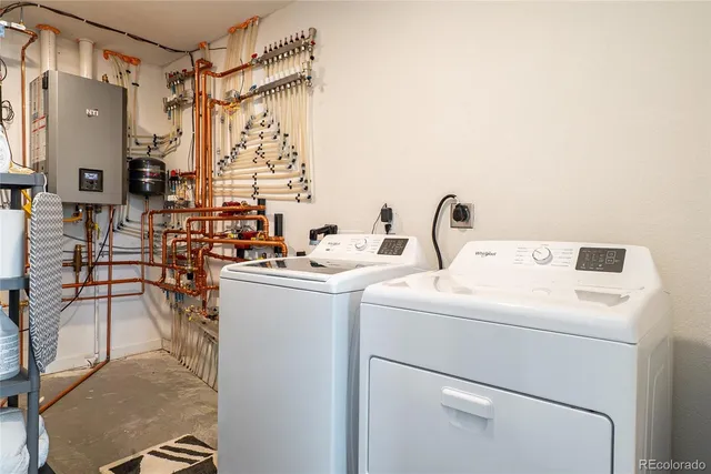 a kitchen with stainless steel appliances granite countertop white cabinets and a stove