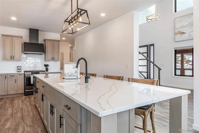 a view of a dining room with furniture large window and wooden floor