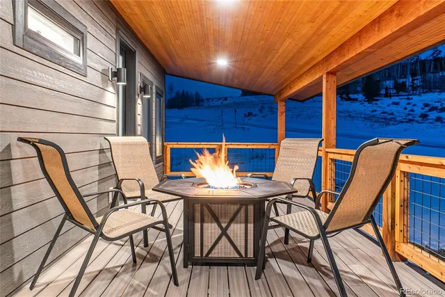 a patio with table and chairs