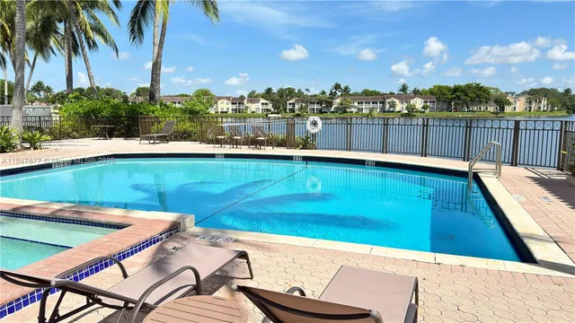 a view of a swimming pool with a lounge chairs