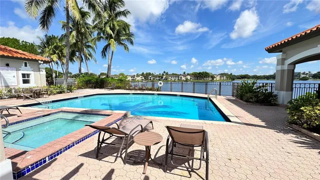 a view of swimming pool with lounge chair