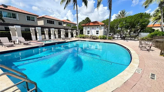 a view of a swimming pool with a patio
