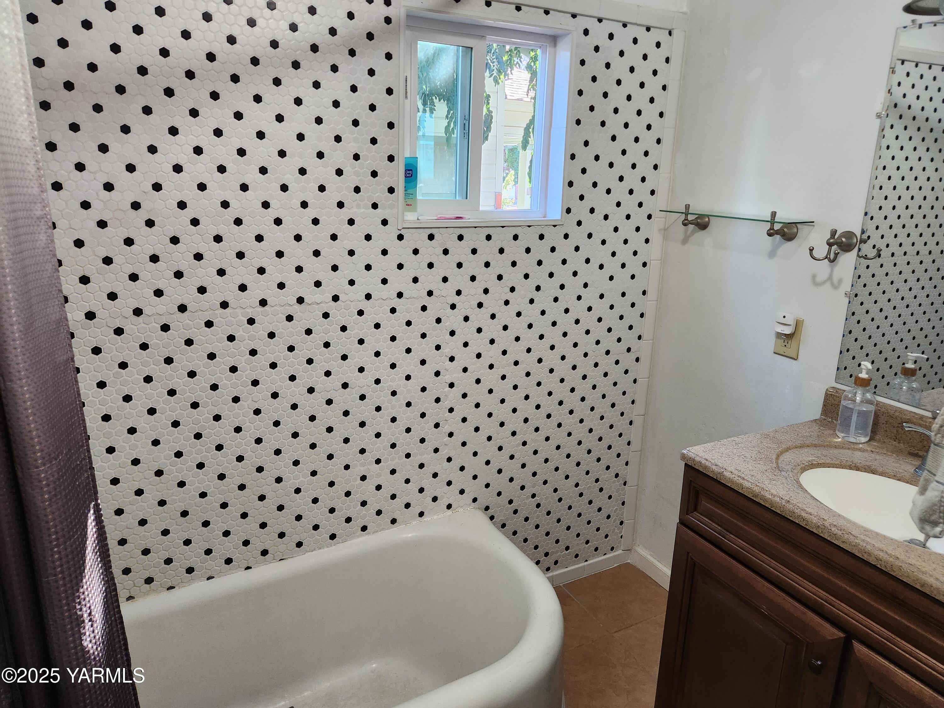 10 South Date Street Toppenish, WA 98948 - Photo 15 of 37 a bathroom with a sink a toilet a mirror and shower
