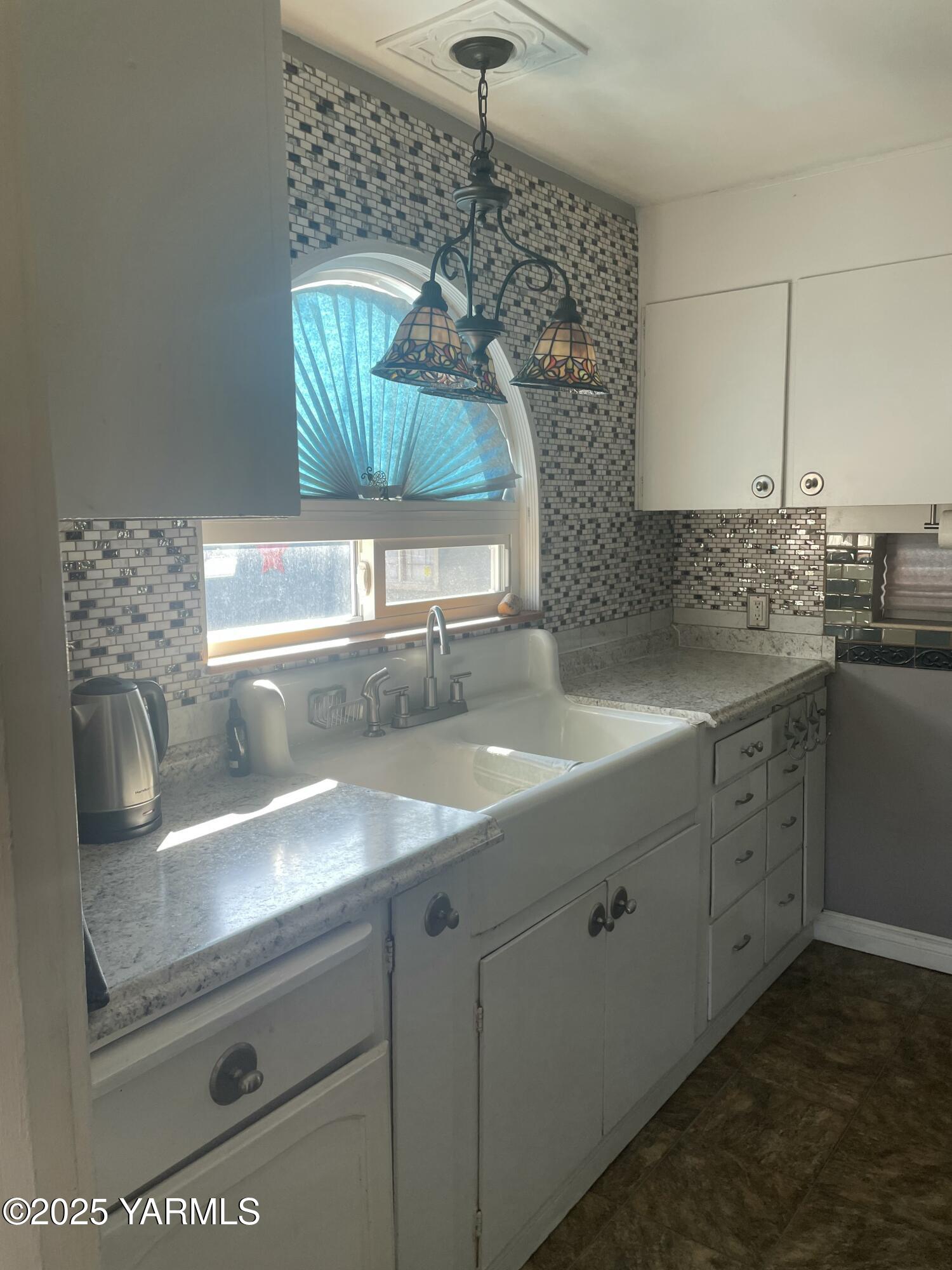 10 South Date Street Toppenish, WA 98948 - Photo 18 of 37 a kitchen with a sink and a window