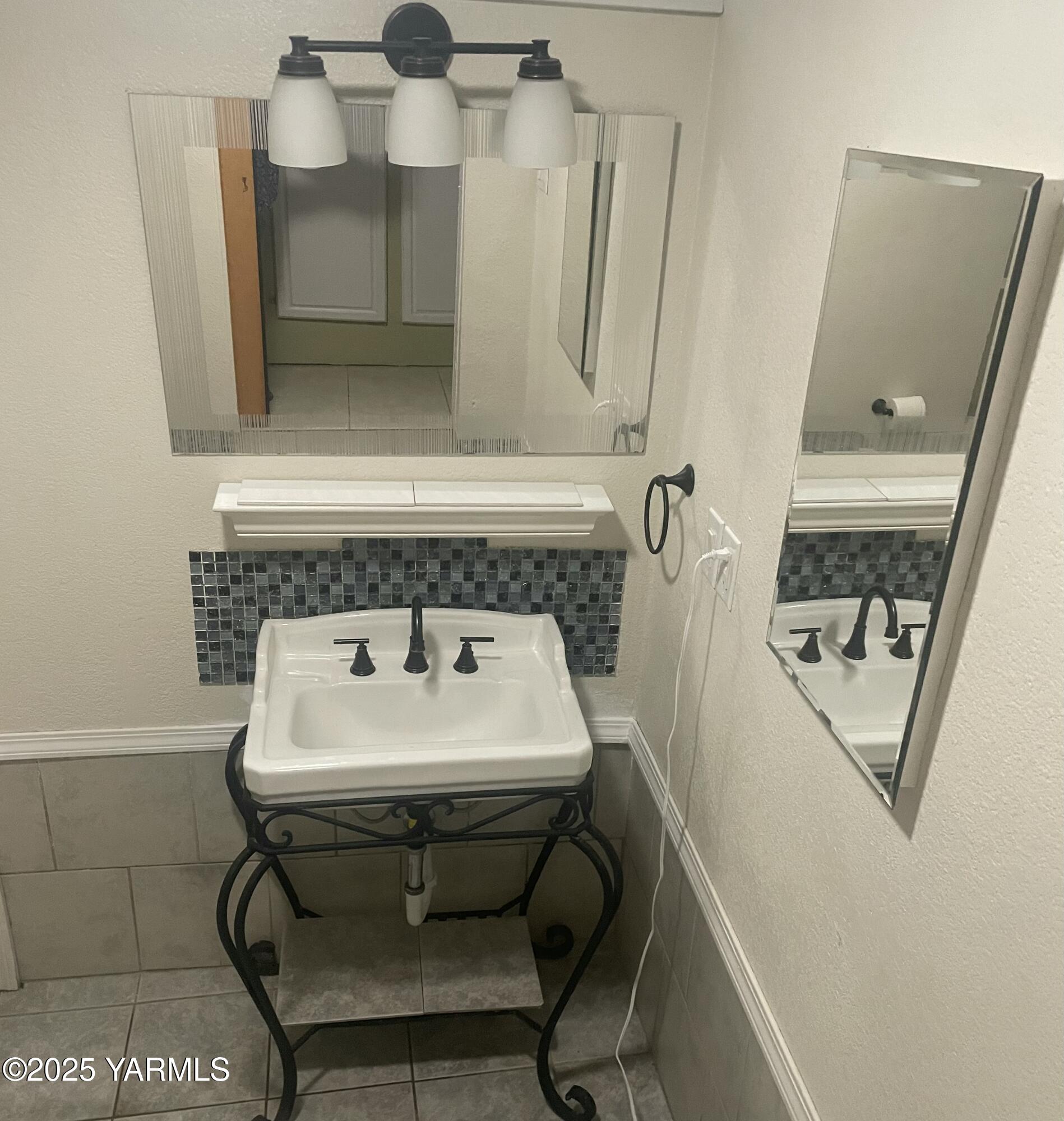 10 South Date Street Toppenish, WA 98948 - Photo 27 of 37 a bathroom with a sink and mirror