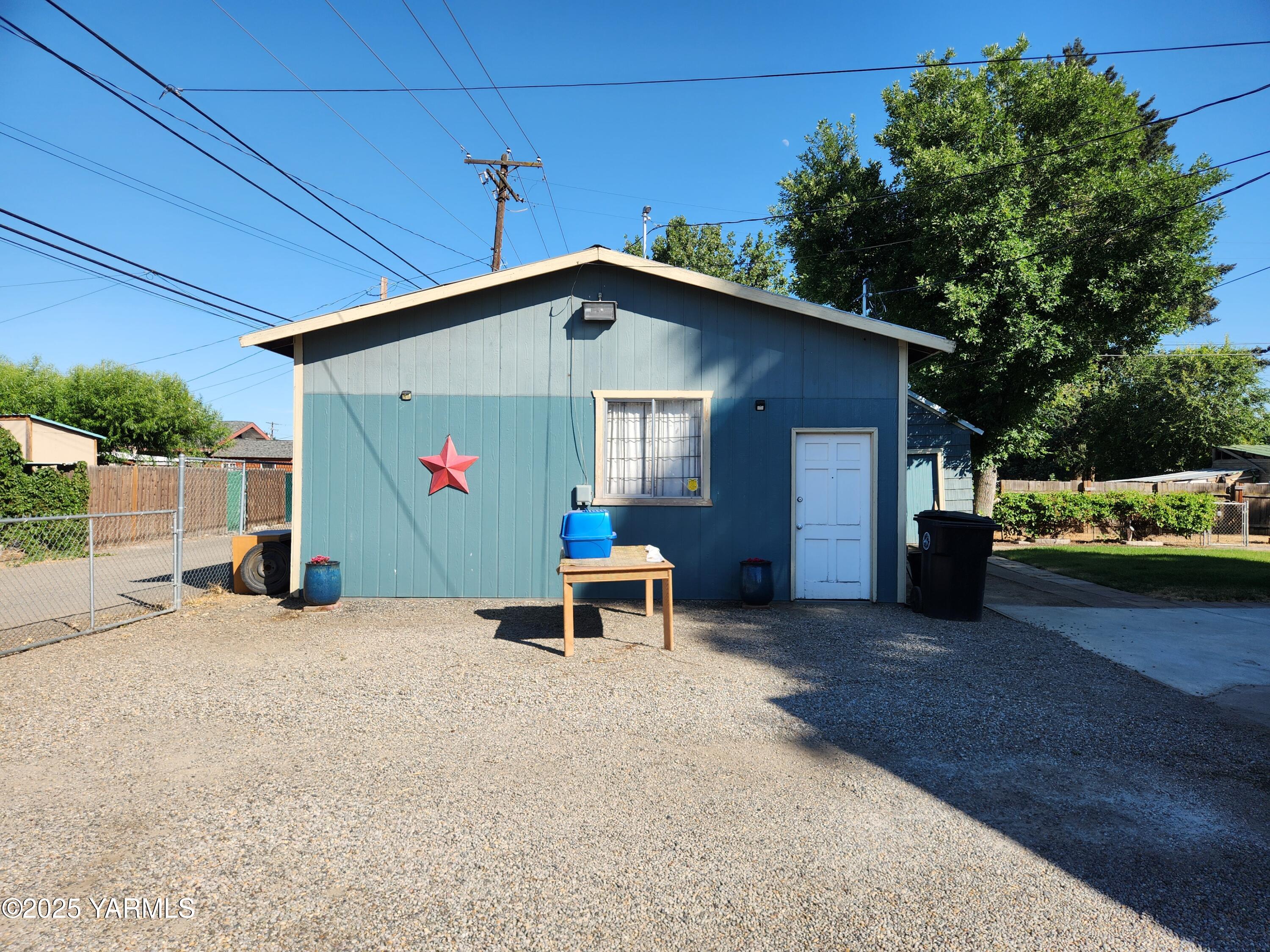 10 South Date Street Toppenish, WA 98948 - Photo 5 of 37 a view of a chair and table in backyard of the house