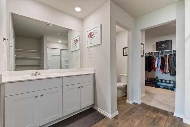 a bathroom with a double vanity sink and a mirror