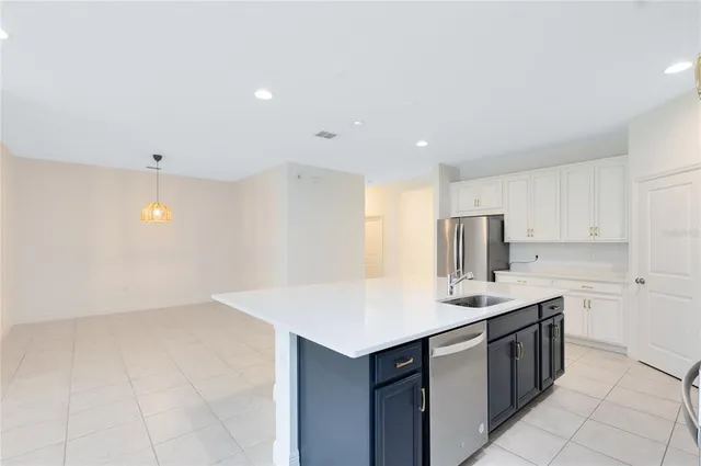 a kitchen with a sink counter top space and cabinets