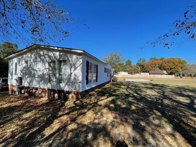 6640 Muscat Road Hope Mills, NC 28348 - Photo 15 of 22 a view of a yard with an outdoor space