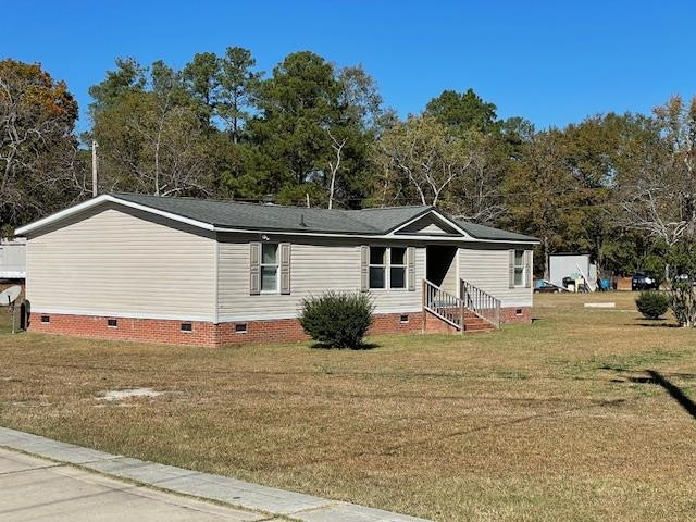 6640 Muscat Road Hope Mills, NC 28348 - Photo 5 of 22 a view of a house with a yard
