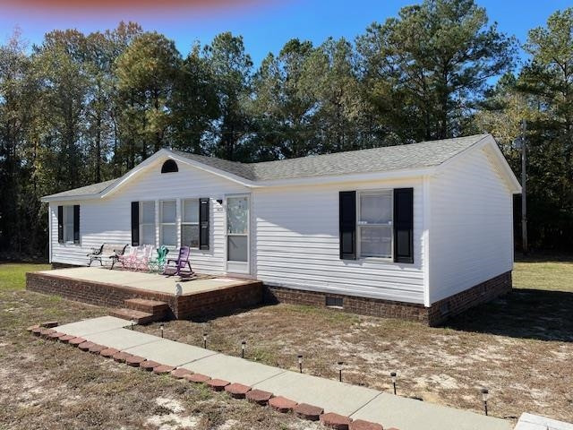 6640 Muscat Road Hope Mills, NC 28348 - Photo 8 of 22 a front view of a house with outdoor space