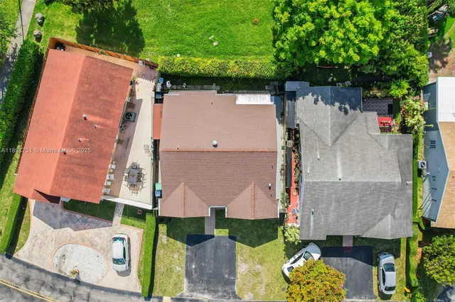 an aerial view of residential house with outdoor space and swimming pool