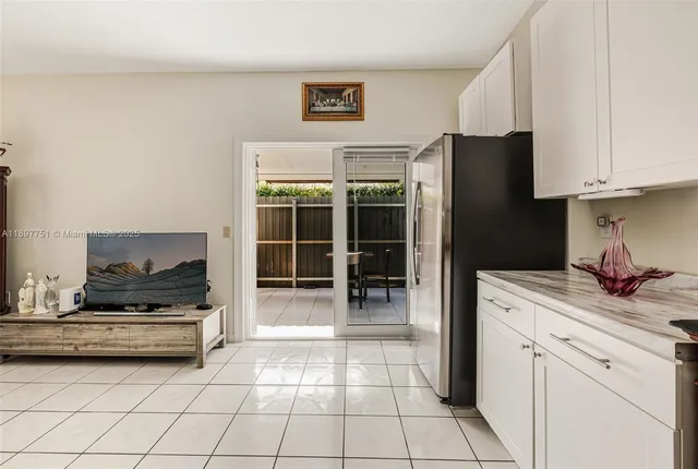 a view of a porch with furniture and a gate