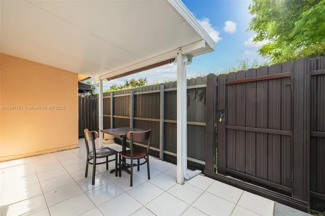 a view of a house with wooden wall