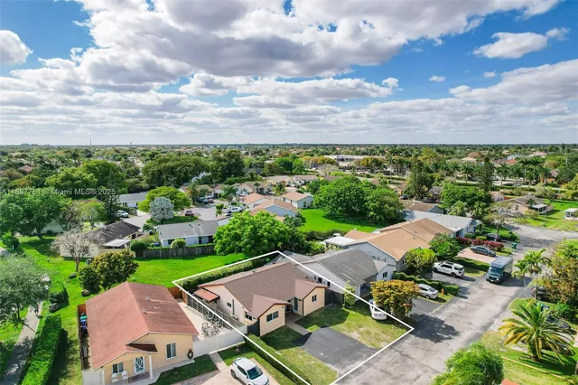an aerial view of a house with garden