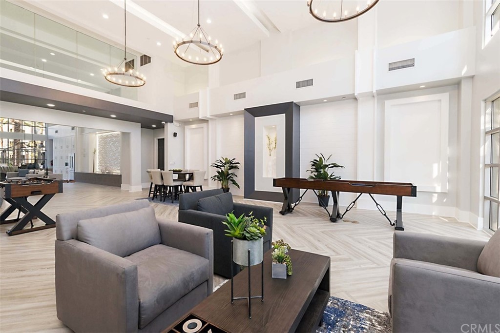1326 Scholarship Irvine, CA 92612 - Photo 13 of 22 a living room with furniture kitchen view and a chandelier