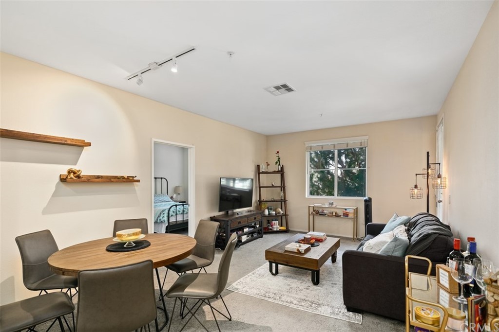 1326 Scholarship Irvine, CA 92612 - Photo 3 of 22 a living room with furniture and a flat screen tv