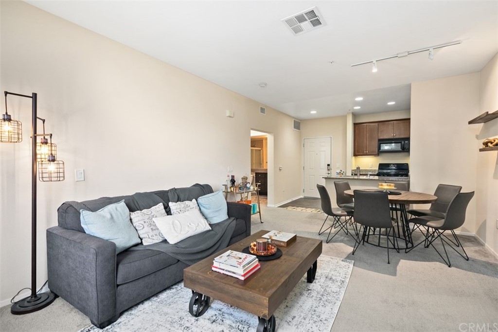 1326 Scholarship Irvine, CA 92612 - Photo 4 of 22 a living room with furniture kitchen view and a table