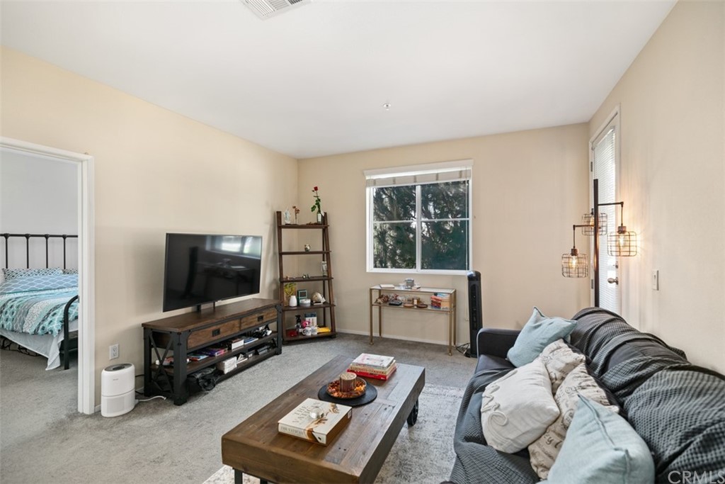 1326 Scholarship Irvine, CA 92612 - Photo 5 of 22 a living room with furniture and a flat screen tv