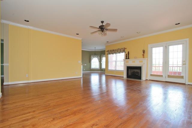 7278 Old Franklin Road Fairview, TN 37062 - Photo 3 of 20 The living room features french doors opening to the back deck and a gas log fireplace.