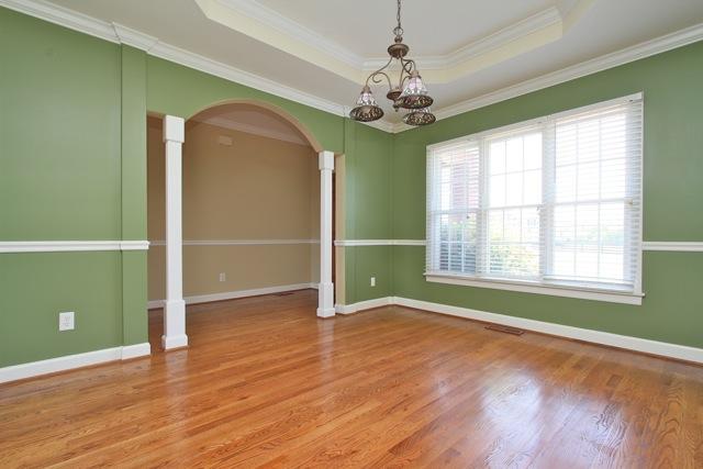 7278 Old Franklin Road Fairview, TN 37062 - Photo 8 of 20 Columns and a tray ceiling accent the formal dining room with windows overlooking the front yard.