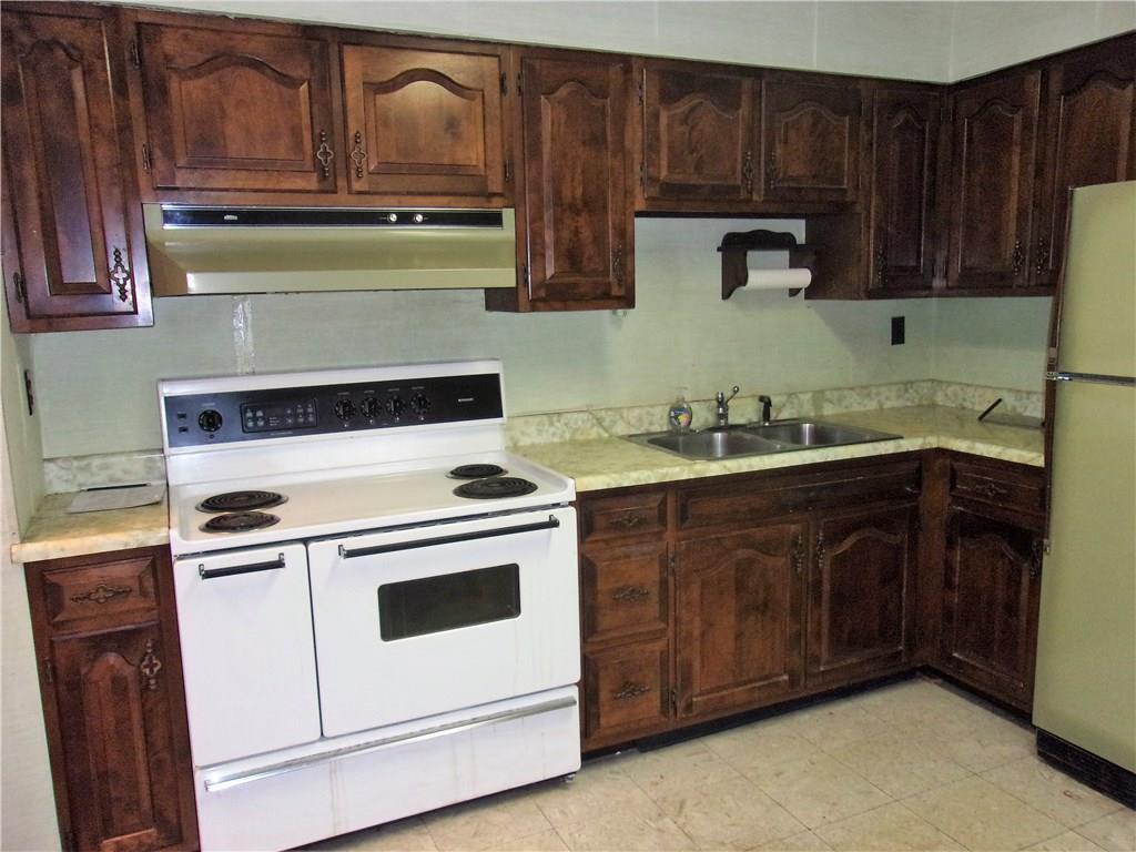 3 Maple Street Trafford, PA 15085 - Photo 7 of 24 Kitchen comes equipped with electric stove and refrigerator.