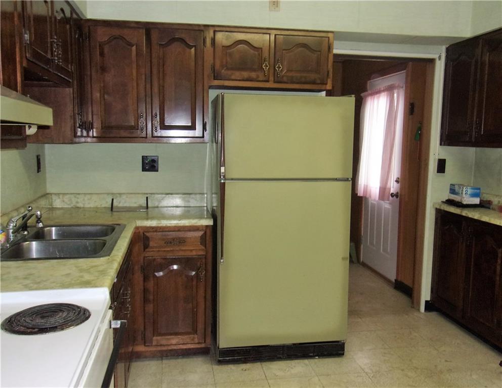 3 Maple Street Trafford, PA 15085 - Photo 8 of 24 Kitchen leads to back entryway, laundry room, half bath and basement.