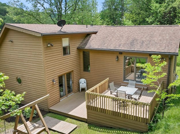 631 Short Brook Road Vincent, OH 45784 - Photo 8 of 31 Rear view of house featuring outdoor dining space, a wooden deck, and roof with shingles