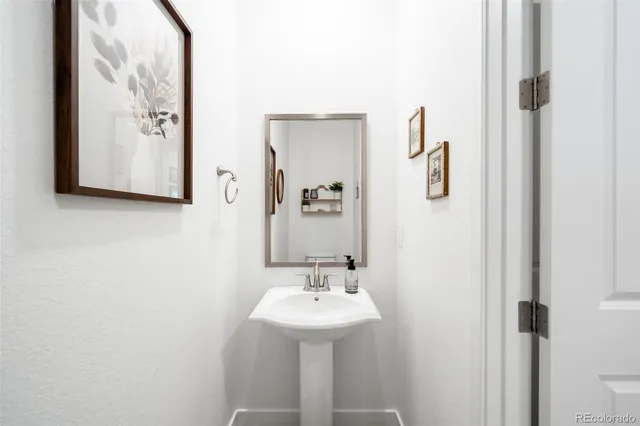 a bathroom with a sink and mirror