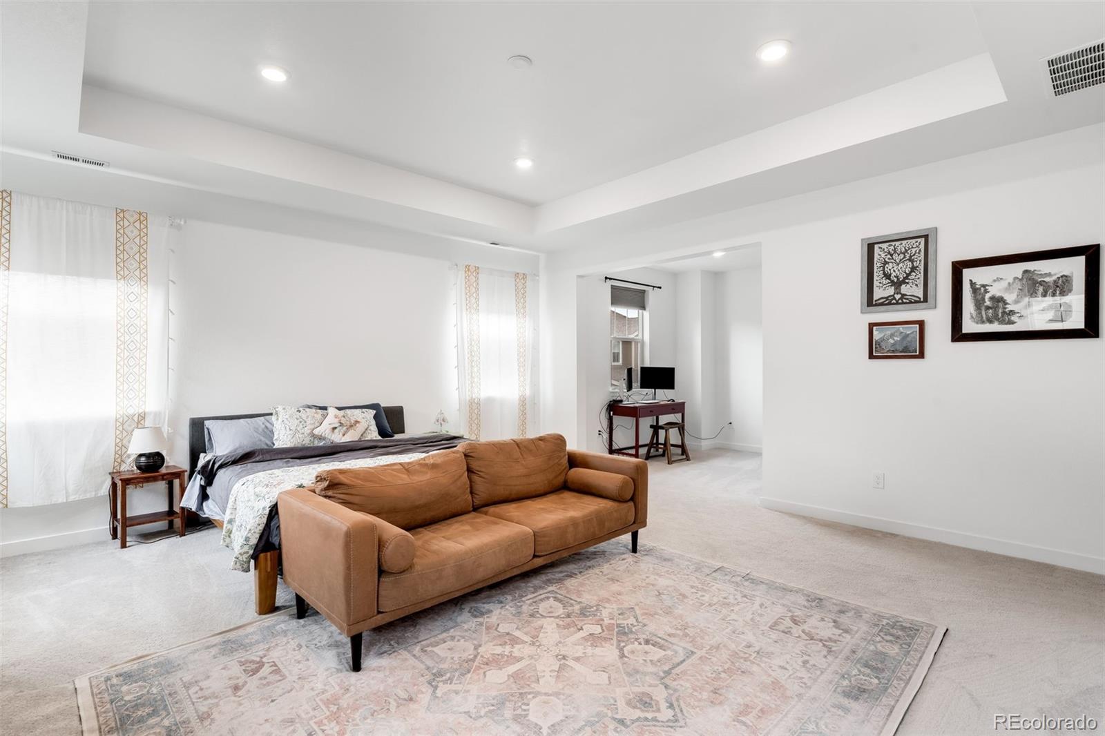 1928 Marlowe Circle West Erie, CO 80516 - Photo 17 of 47 a living room with furniture and a couch
