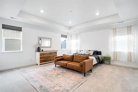 a bedroom with bed and window